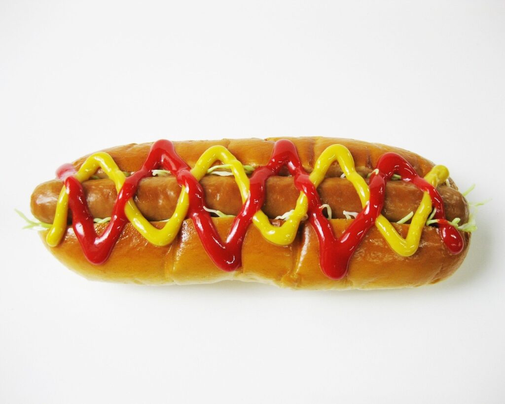 A hot dog with mustard and ketchup