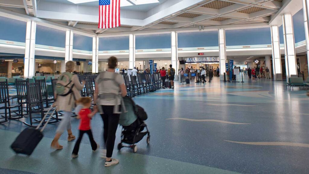 Passengers walk through Jacksonville International.