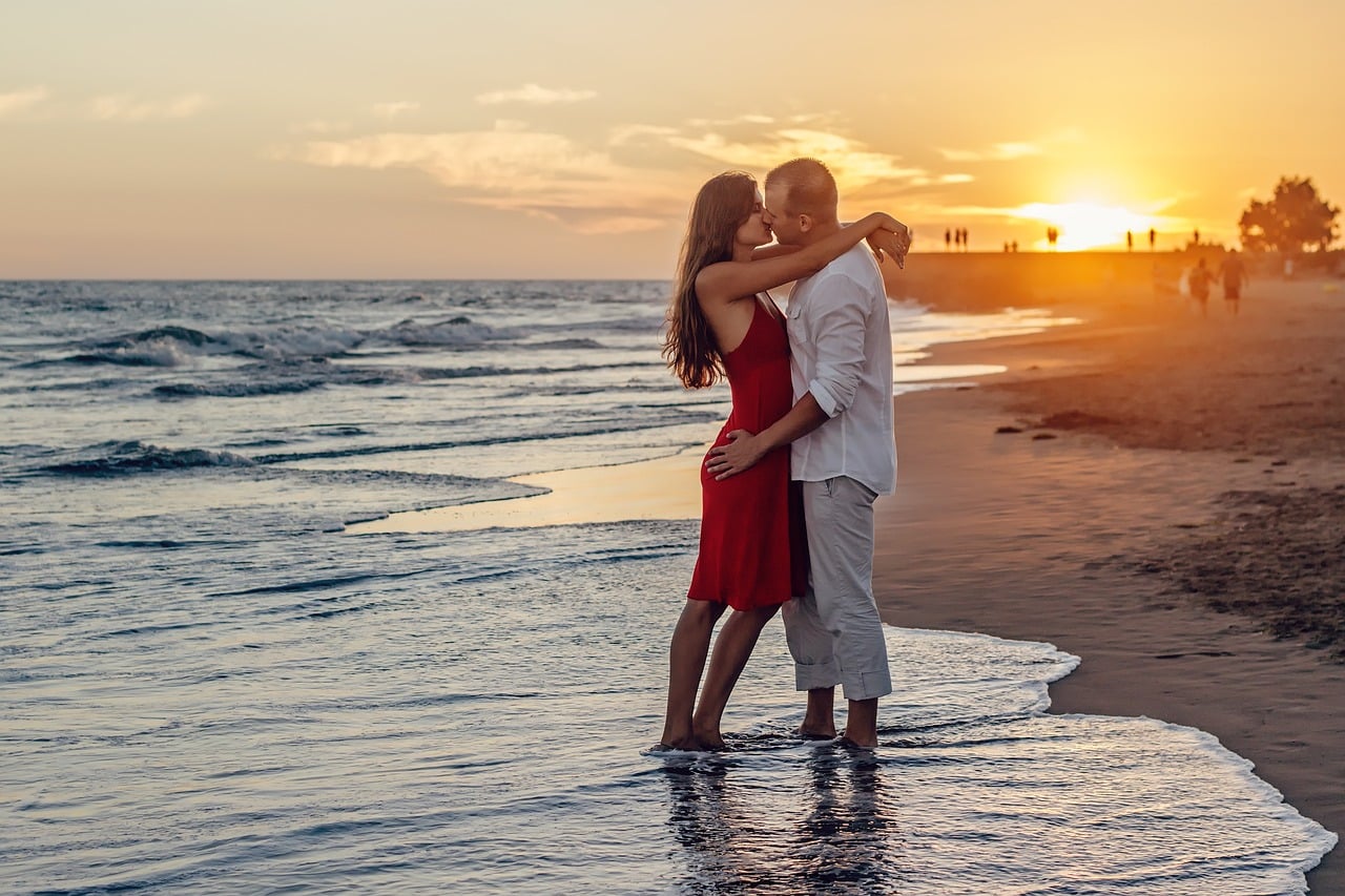 Couple kissing on the beach